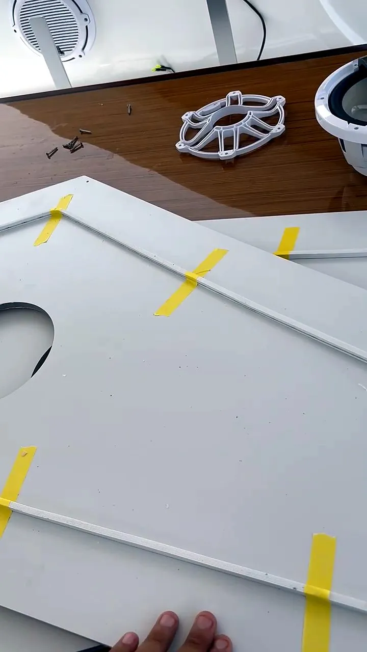 Custom white panel prepared for marine speaker installation